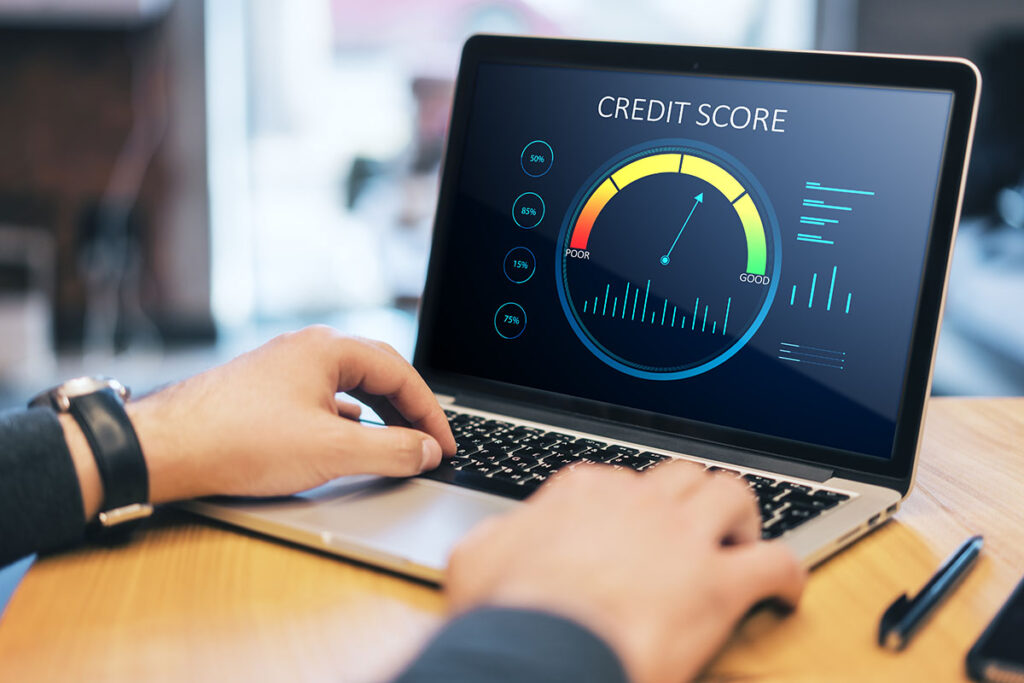 Close-up of credit score scale on laptop screen, highlighting the concept of good or bad credit