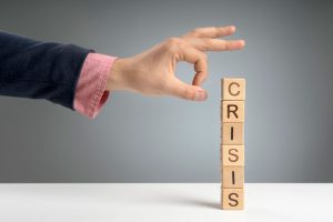 Wooden blocks with crisis message depicting the borrowing crisis amid the Covid-19 pandemic