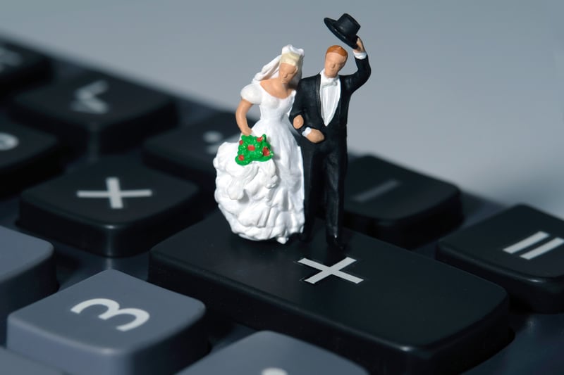 A bride and groom in mini figurines representing a happy union