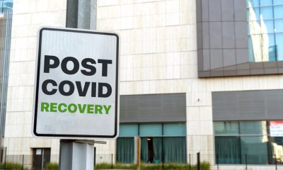 Signboard outside office building reads ‘POST COVID RECOVERY’